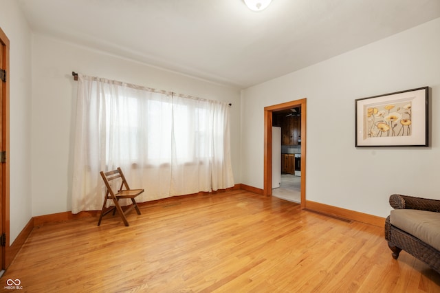 living area with light hardwood / wood-style floors