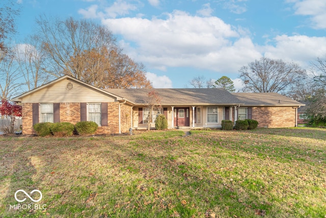 ranch-style home featuring a front yard