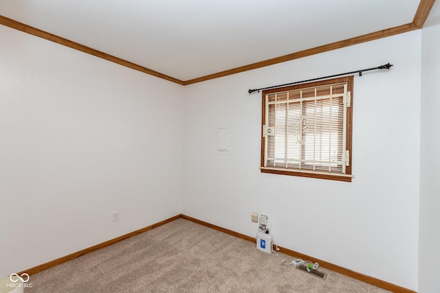 carpeted empty room featuring ornamental molding