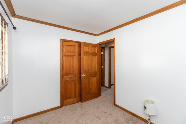 unfurnished bedroom featuring ornamental molding and light carpet