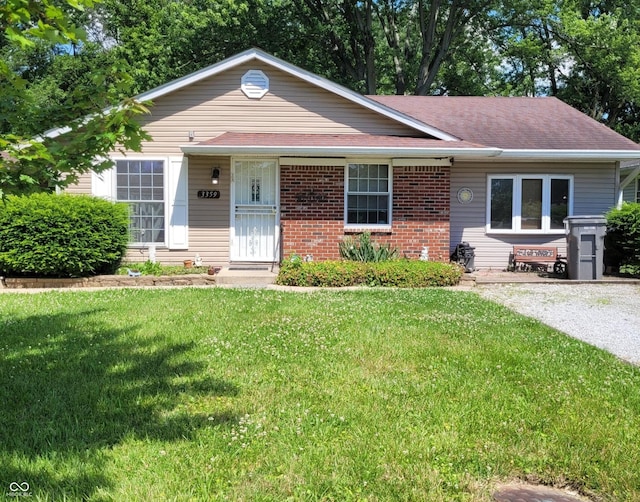 ranch-style house with a front lawn