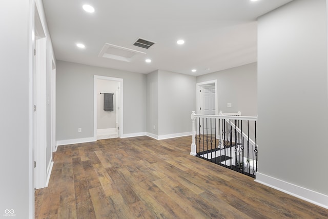 unfurnished room featuring dark wood-type flooring