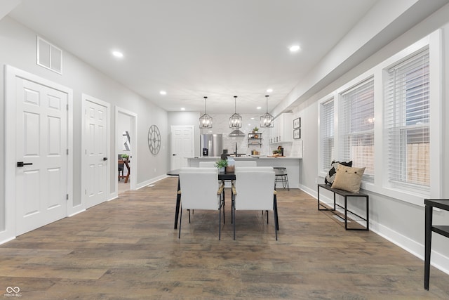 dining room featuring dark wood-type flooring