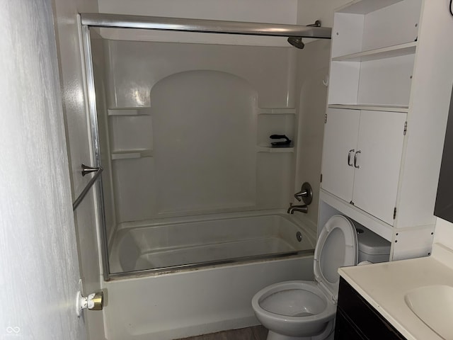 full bathroom with vanity, toilet, and bath / shower combo with glass door