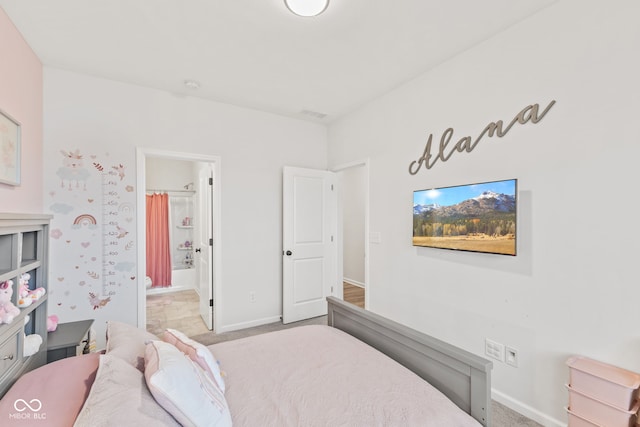 carpeted bedroom with ensuite bathroom