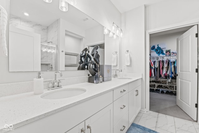 bathroom with vanity and walk in shower