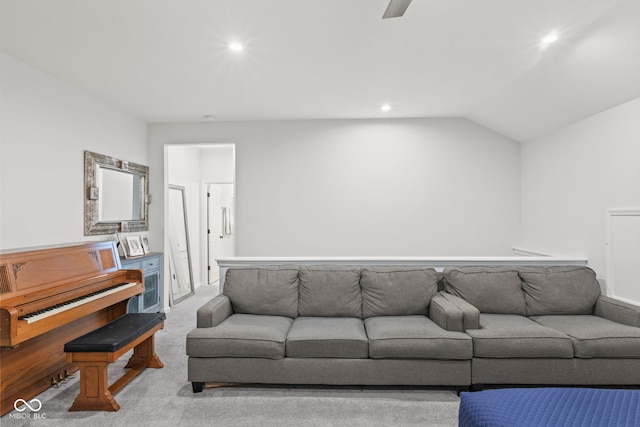 carpeted living room with lofted ceiling