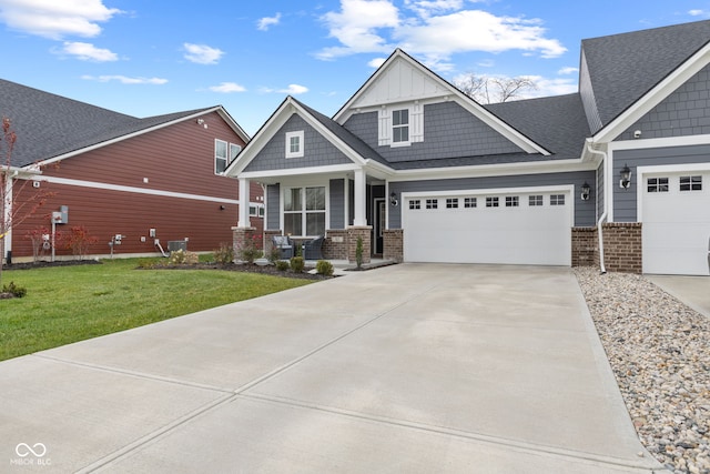 craftsman-style home featuring covered porch, central AC, a garage, and a front lawn