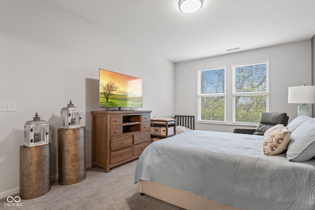 bedroom with light carpet