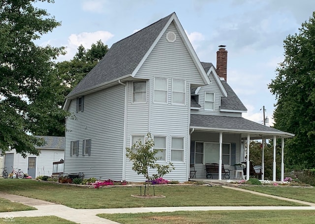 view of front of property featuring a porch and a front yard