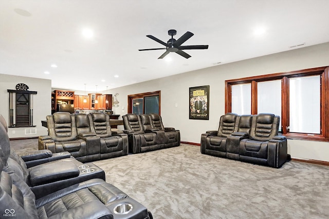 cinema featuring carpet floors and ceiling fan