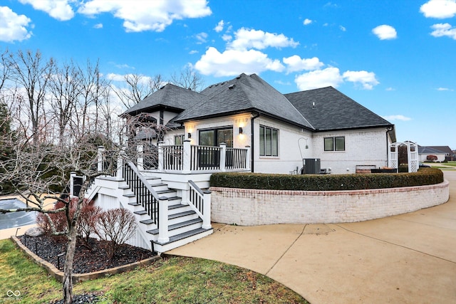 exterior space featuring a deck and cooling unit