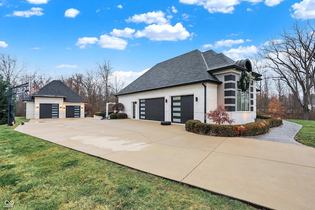 view of side of property featuring a garage and an outdoor structure