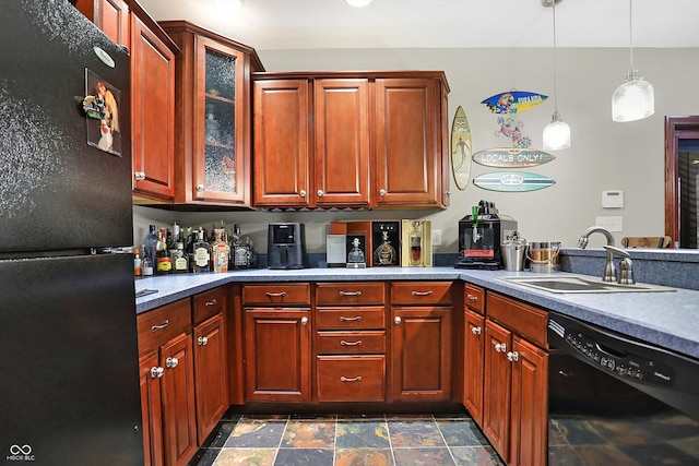 kitchen featuring sink, hanging light fixtures, and black appliances