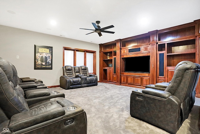 carpeted living room featuring ceiling fan