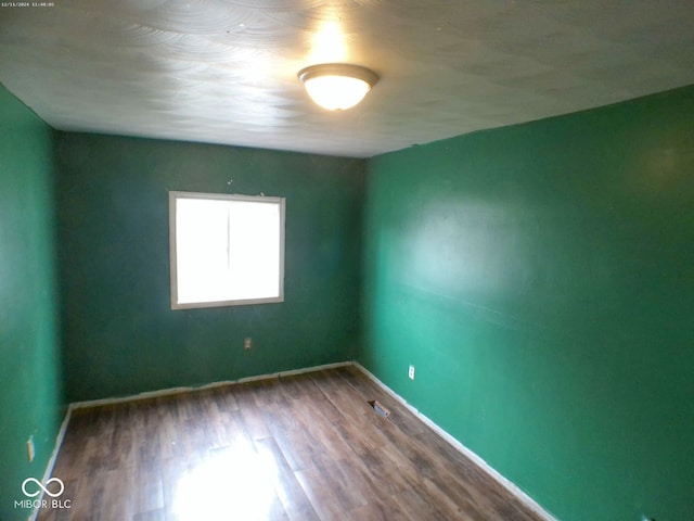 empty room featuring hardwood / wood-style flooring