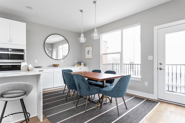 dining room with wood-type flooring