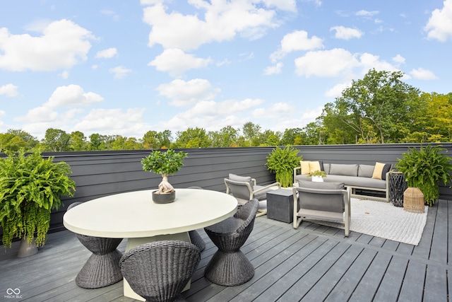 wooden terrace with outdoor lounge area