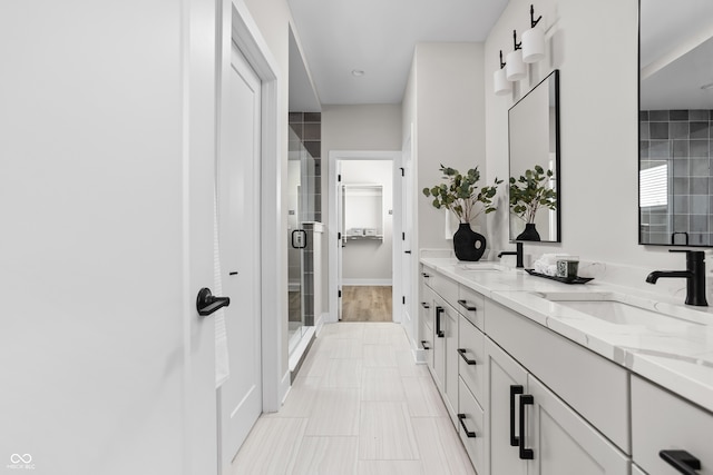 bathroom featuring vanity, hardwood / wood-style flooring, and walk in shower