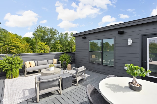 wooden terrace featuring an outdoor living space