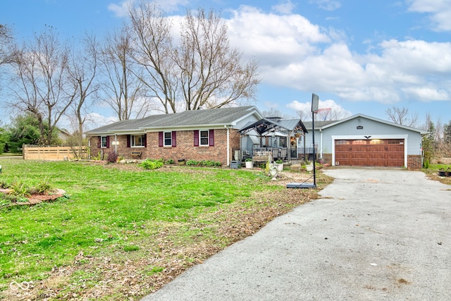 single story home featuring a garage and a front yard