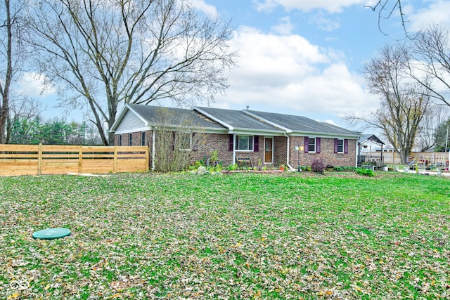 ranch-style house with a front lawn