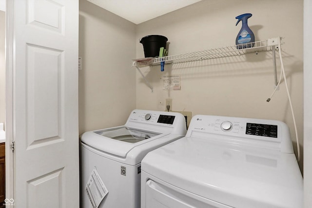 laundry area with separate washer and dryer