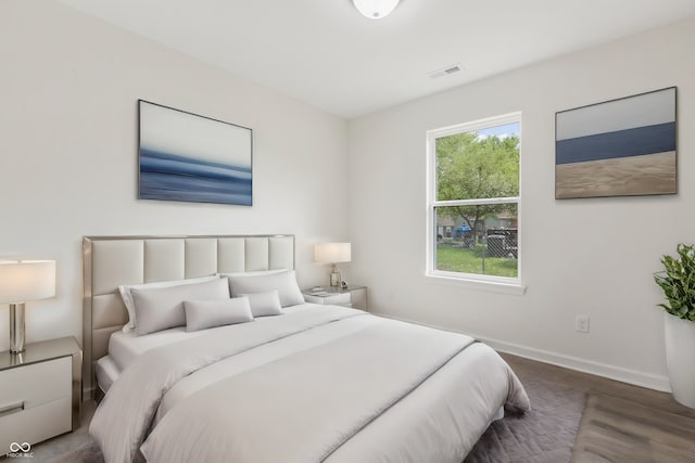 bedroom featuring dark hardwood / wood-style flooring