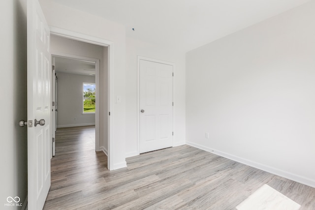 unfurnished room with light hardwood / wood-style floors