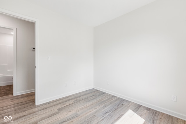 unfurnished room with light hardwood / wood-style flooring