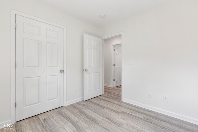 unfurnished bedroom with light hardwood / wood-style floors