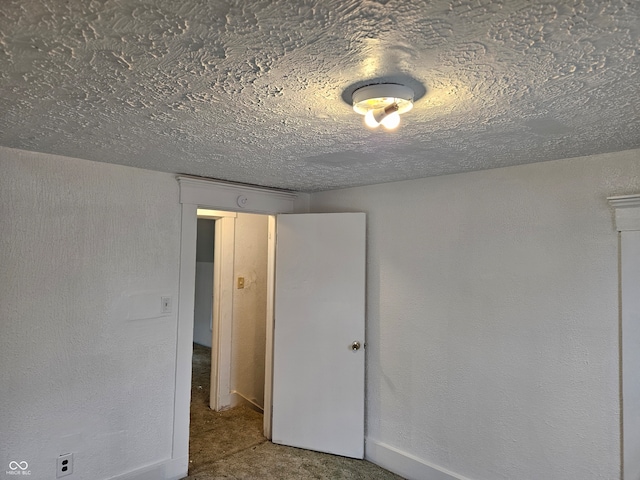 unfurnished bedroom with a textured ceiling