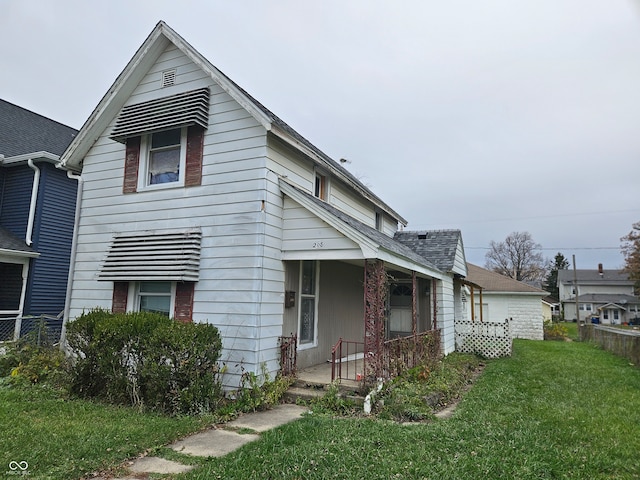 view of front facade with a porch and a front yard