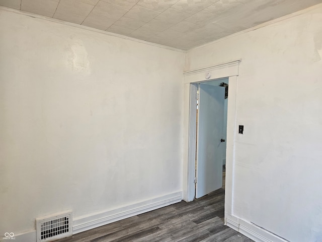 empty room with dark hardwood / wood-style floors