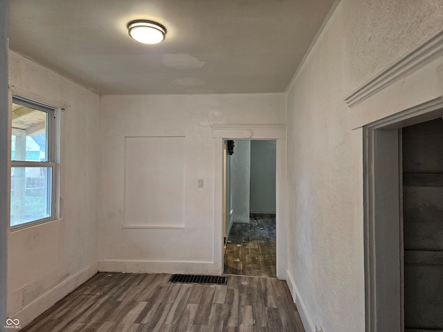 empty room with dark hardwood / wood-style floors