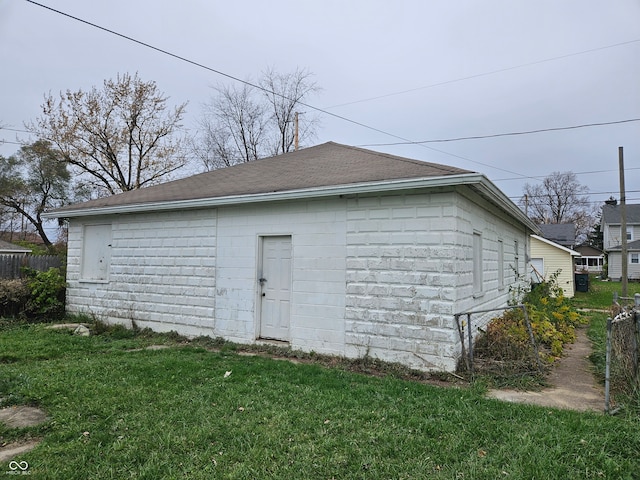 view of outbuilding with a lawn