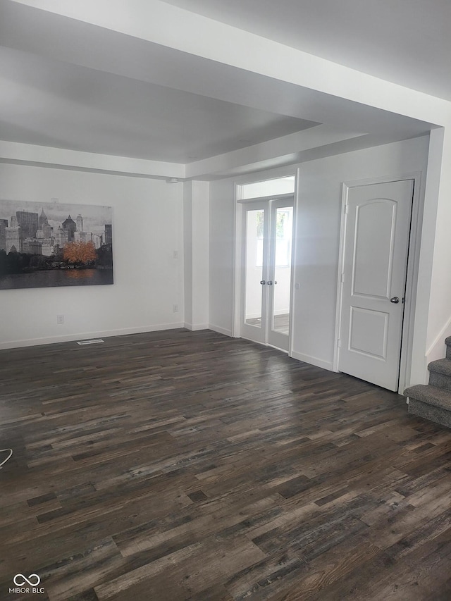 unfurnished room with french doors and dark hardwood / wood-style floors