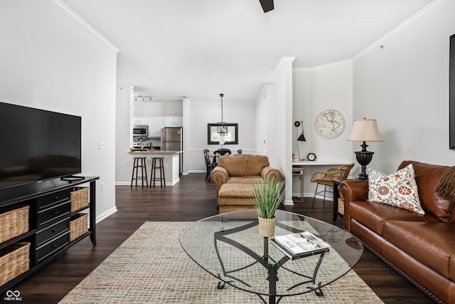 living room featuring dark hardwood / wood-style floors and crown molding