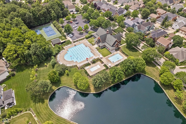 birds eye view of property with a water view