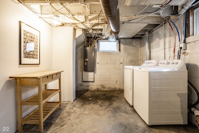 basement featuring washer and dryer and electric panel