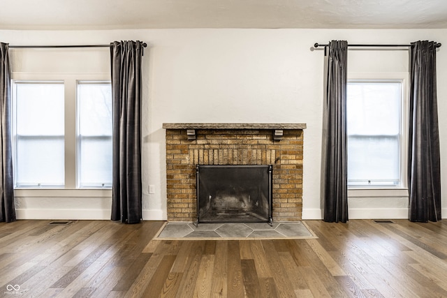 room details with a fireplace and wood-type flooring