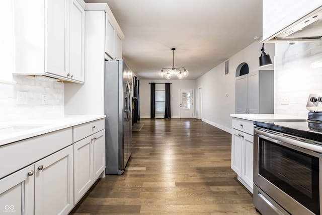 kitchen featuring exhaust hood, white cabinets, hanging light fixtures, dark hardwood / wood-style floors, and stainless steel appliances