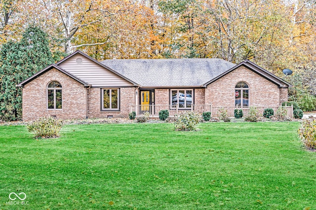 ranch-style home featuring a front lawn