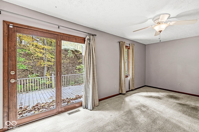 interior space featuring a textured ceiling and ceiling fan