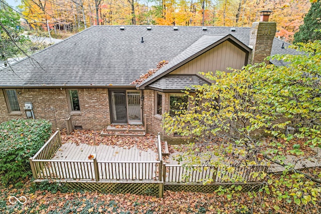 rear view of property featuring a deck