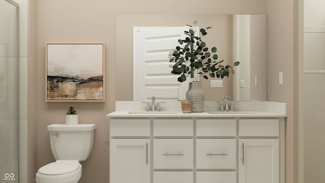 bathroom featuring toilet and vanity