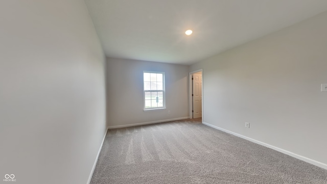 unfurnished room featuring carpet