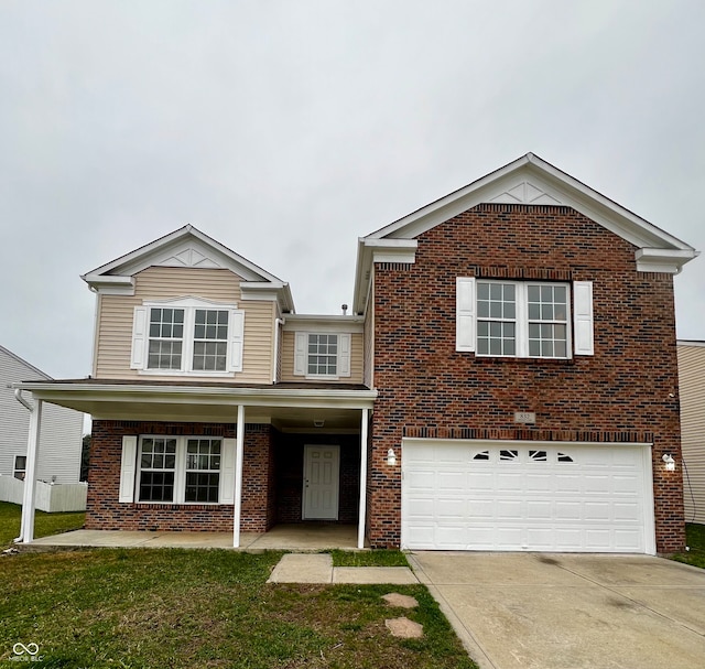 view of front property with a garage and a front lawn