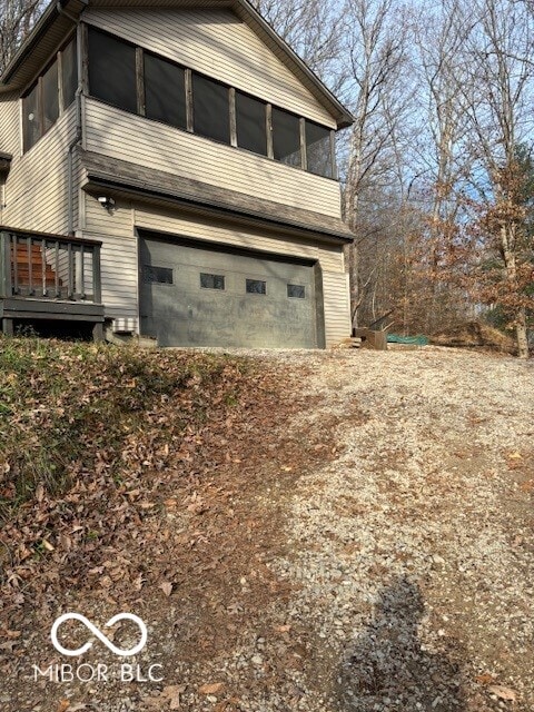 view of side of property featuring a garage