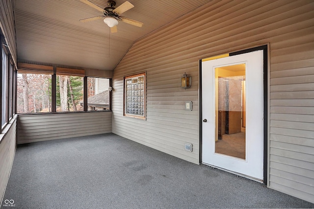 unfurnished sunroom with ceiling fan, wooden ceiling, and vaulted ceiling